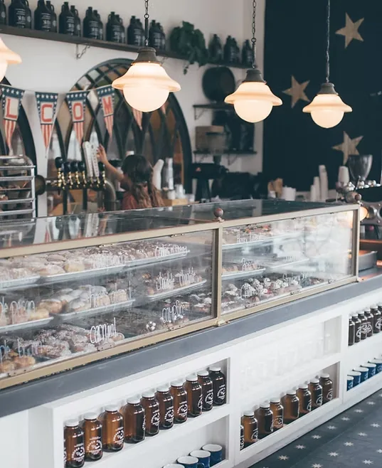 Doughnut display case under pendant lights
